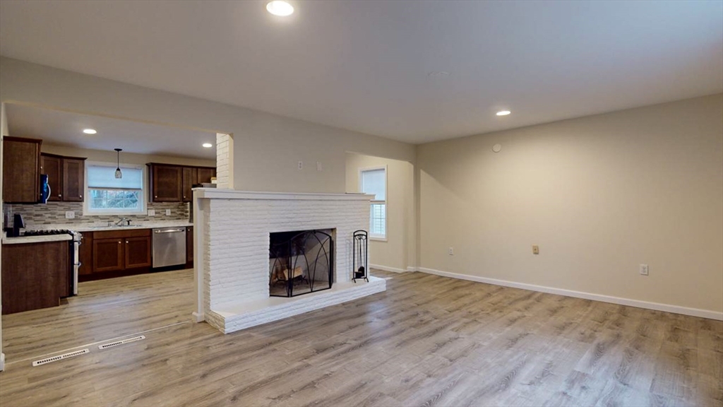 195 Riverton Road Springfield, MA 01109 - Photo 16 of 42 a view of a room with kitchen and fireplace