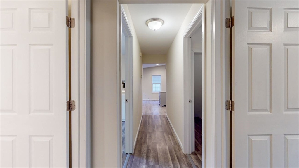 195 Riverton Road Springfield, MA 01109 - Photo 22 of 42 a view of a bathroom from a hallway