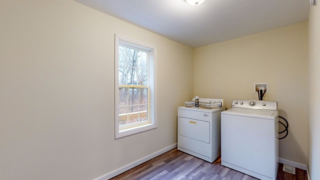 195 Riverton Road Springfield, MA 01109 - Photo 24 of 42 a view of storage and utility room with washer and dryer