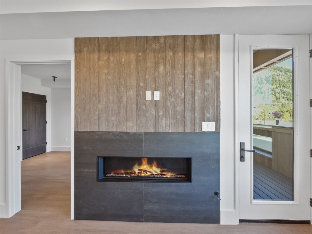 80 West Main Street, Unit 212 Frisco, CO 80443 - Photo 14 of 45 a living room with furniture and a fireplace