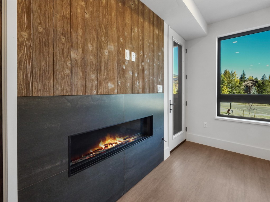 80 West Main Street, Unit 212 Frisco, CO 80443 - Photo 16 of 45 a living room with furniture and a fireplace