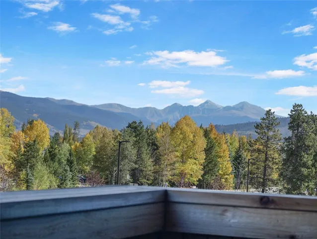 a view of a balcony with wooden floor