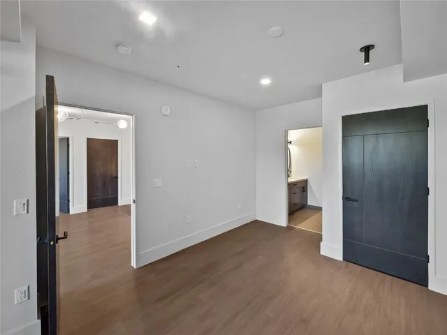 a bathroom with a granite countertop double vanity sink and a mirror