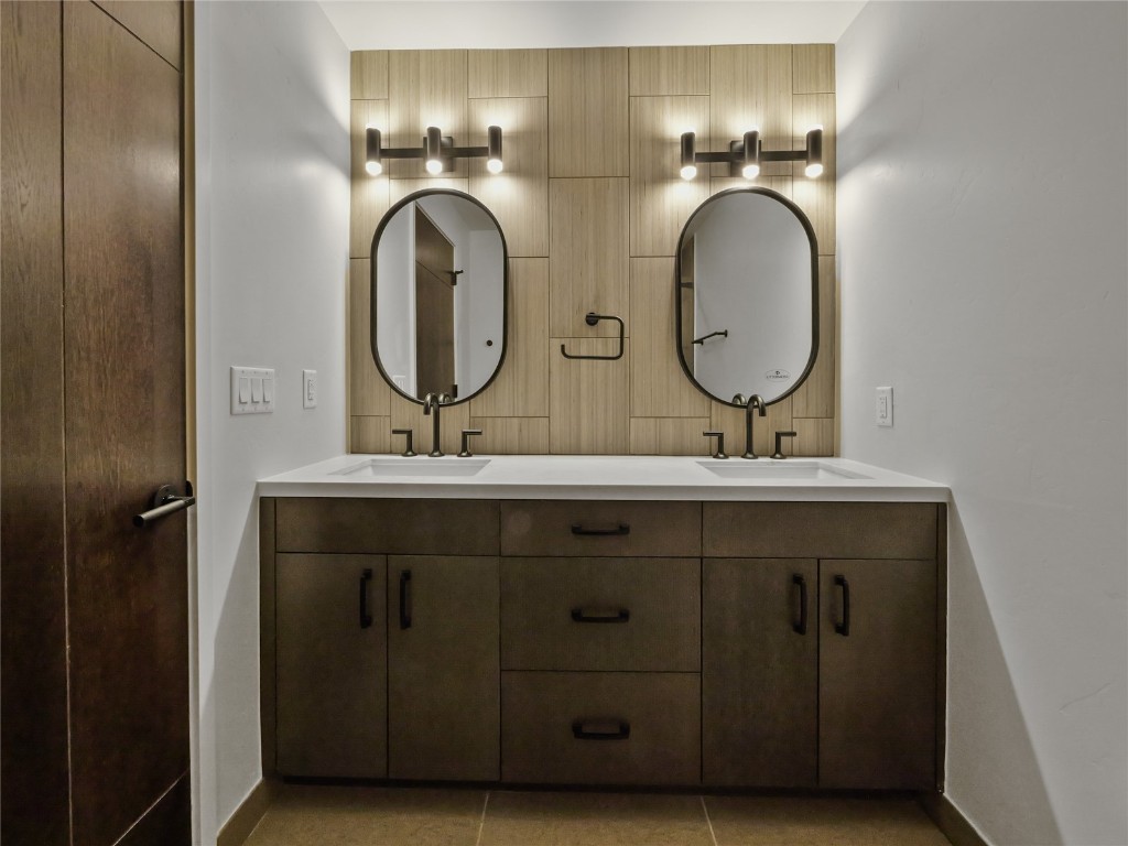 80 West Main Street, Unit 212 Frisco, CO 80443 - Photo 26 of 45 a bathroom with a granite countertop double vanity sink and a mirror