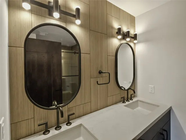 an empty room with wooden floor and a window