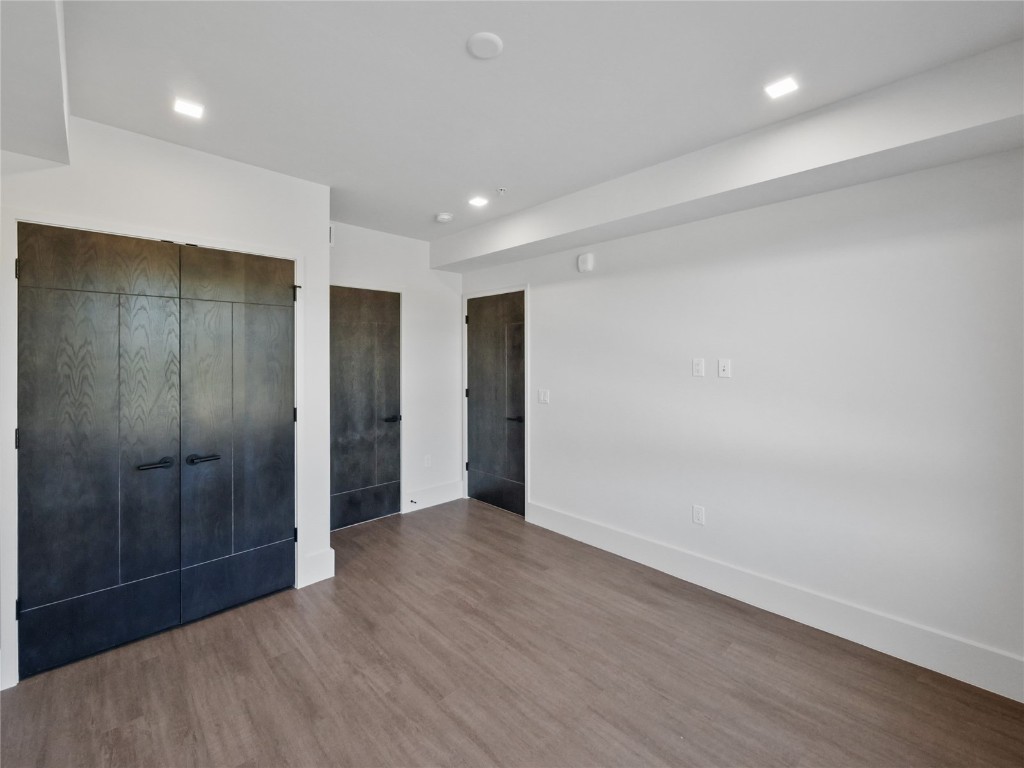 80 West Main Street, Unit 212 Frisco, CO 80443 - Photo 31 of 45 an empty room with wooden floor and closet