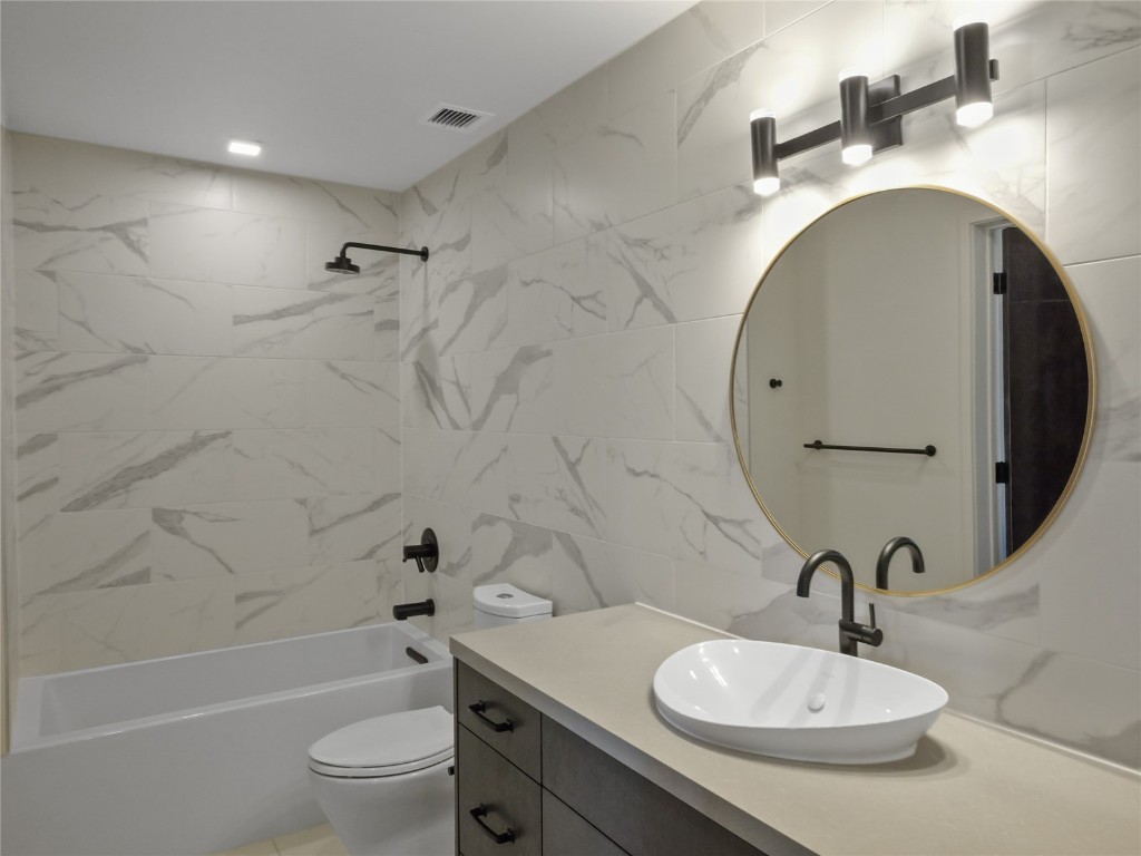 80 West Main Street, Unit 212 Frisco, CO 80443 - Photo 34 of 45 a bathroom with a sink a toilet and shower