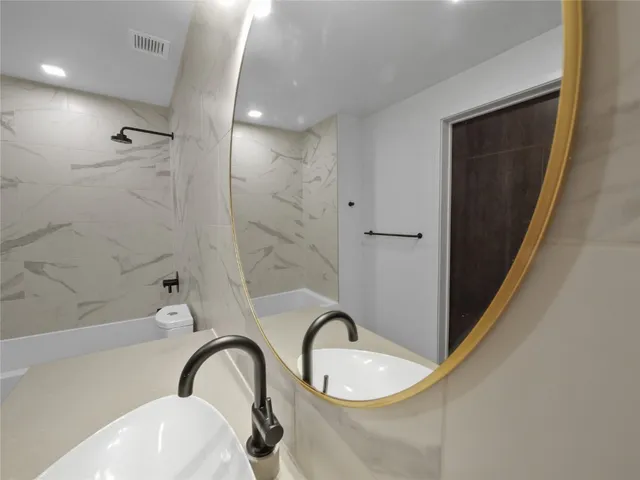 a kitchen with stainless steel appliances a refrigerator and a sink