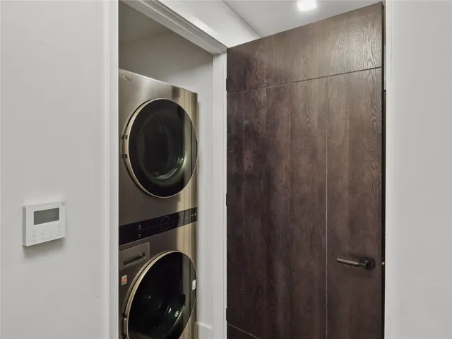 a living room with furniture a chandelier and a fireplace