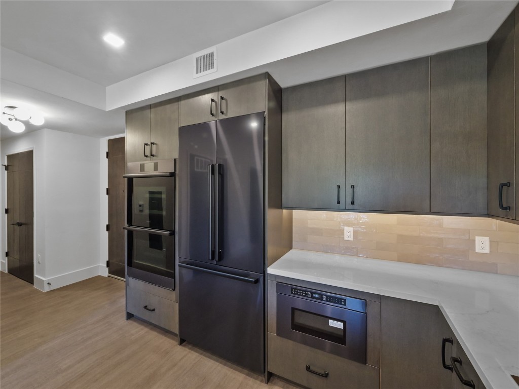80 West Main Street, Unit 212 Frisco, CO 80443 - Photo 6 of 45 a kitchen with a refrigerator and a sink