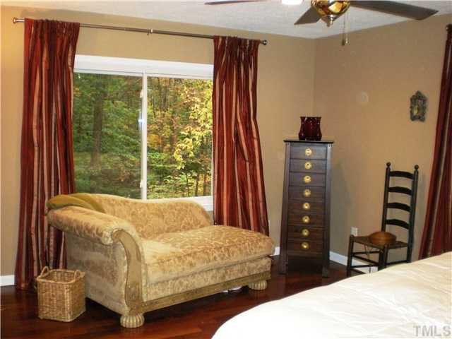 3417 Hackney Court Raleigh, NC 27613 - Photo 11 of 23 Another view of the master bedroom highlighting the large windows which offer more amazing views of this natural setting. Master Bedroom
