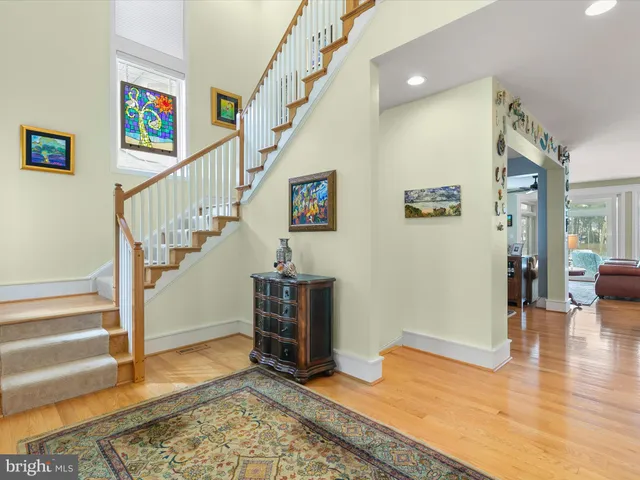 a kitchen with stainless steel appliances granite countertop a refrigerator a stove top oven a sink and dishwasher