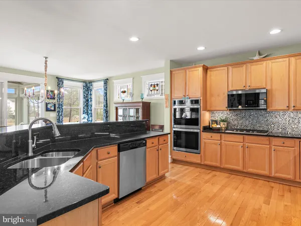 a view of a dining room with furniture and window
