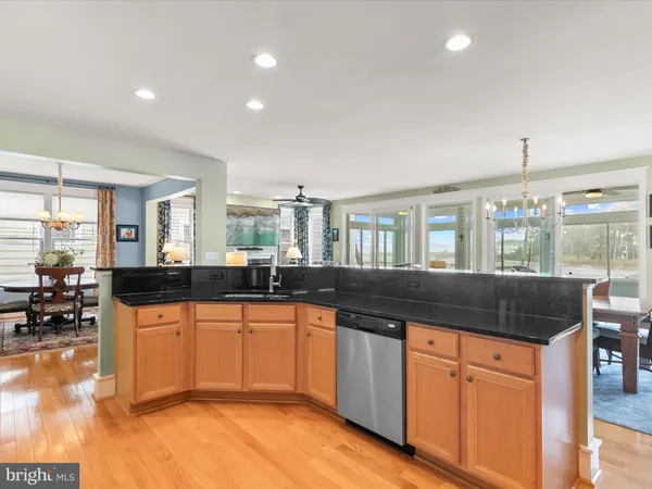 a bathroom with a double vanity sink a mirror a bathtub and shower