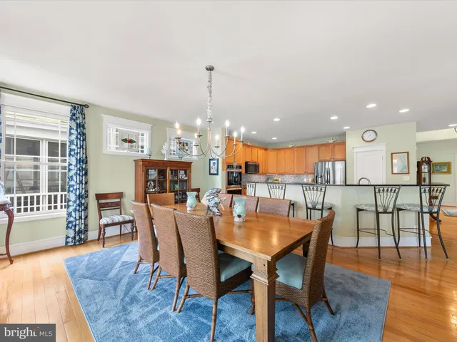 a view of a dining room with furniture and window