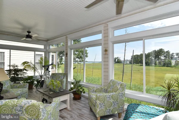 a bathroom with a tub a sink and a mirror