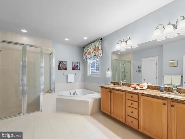 a white house that has tree in front of it