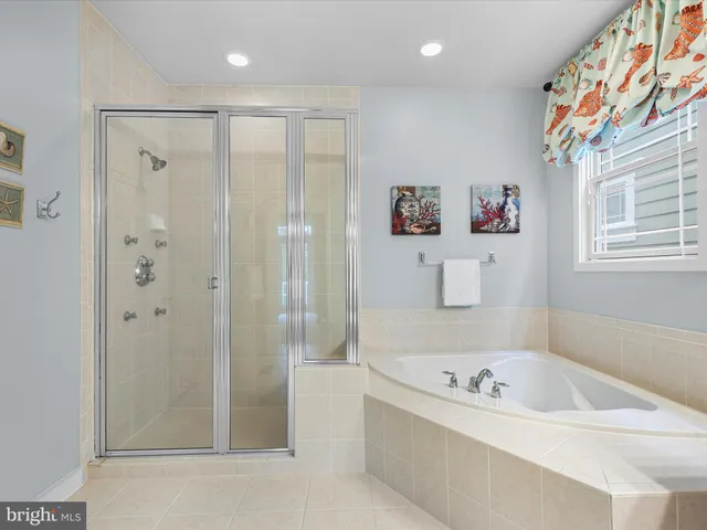 a bed room with furniture and a flat screen tv