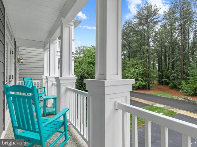 a bedroom with a bed and a mirror on dresser