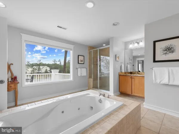 an aerial view of a house with garden space and outdoor seating