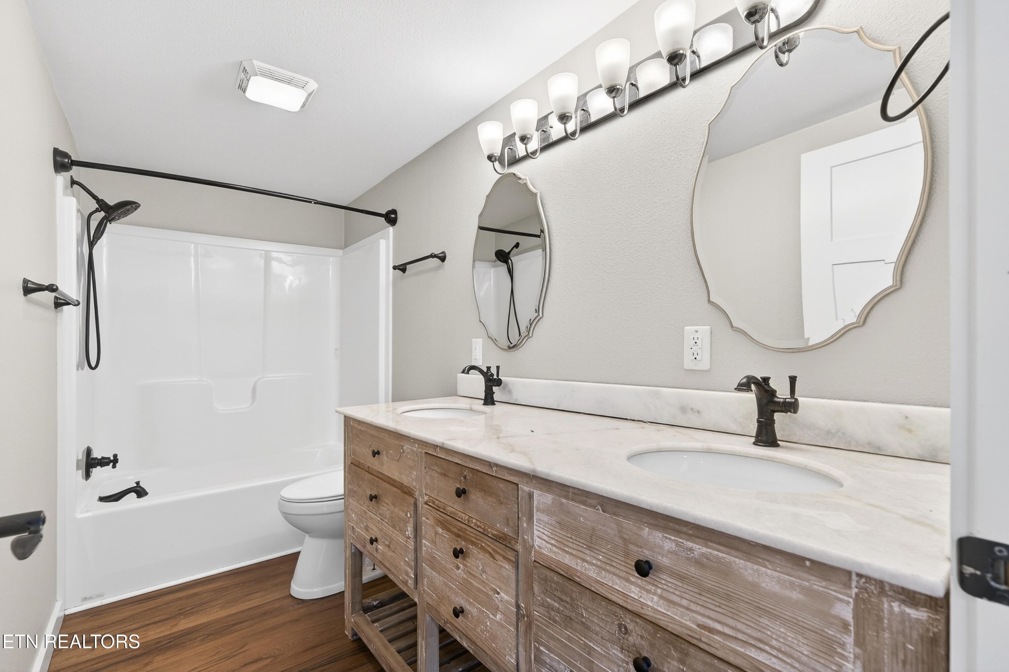 2496 Chestnut Hill Road Crossville, TN 38571 - Photo 17 of 38 a bathroom with a double vanity sink mirror and toilet