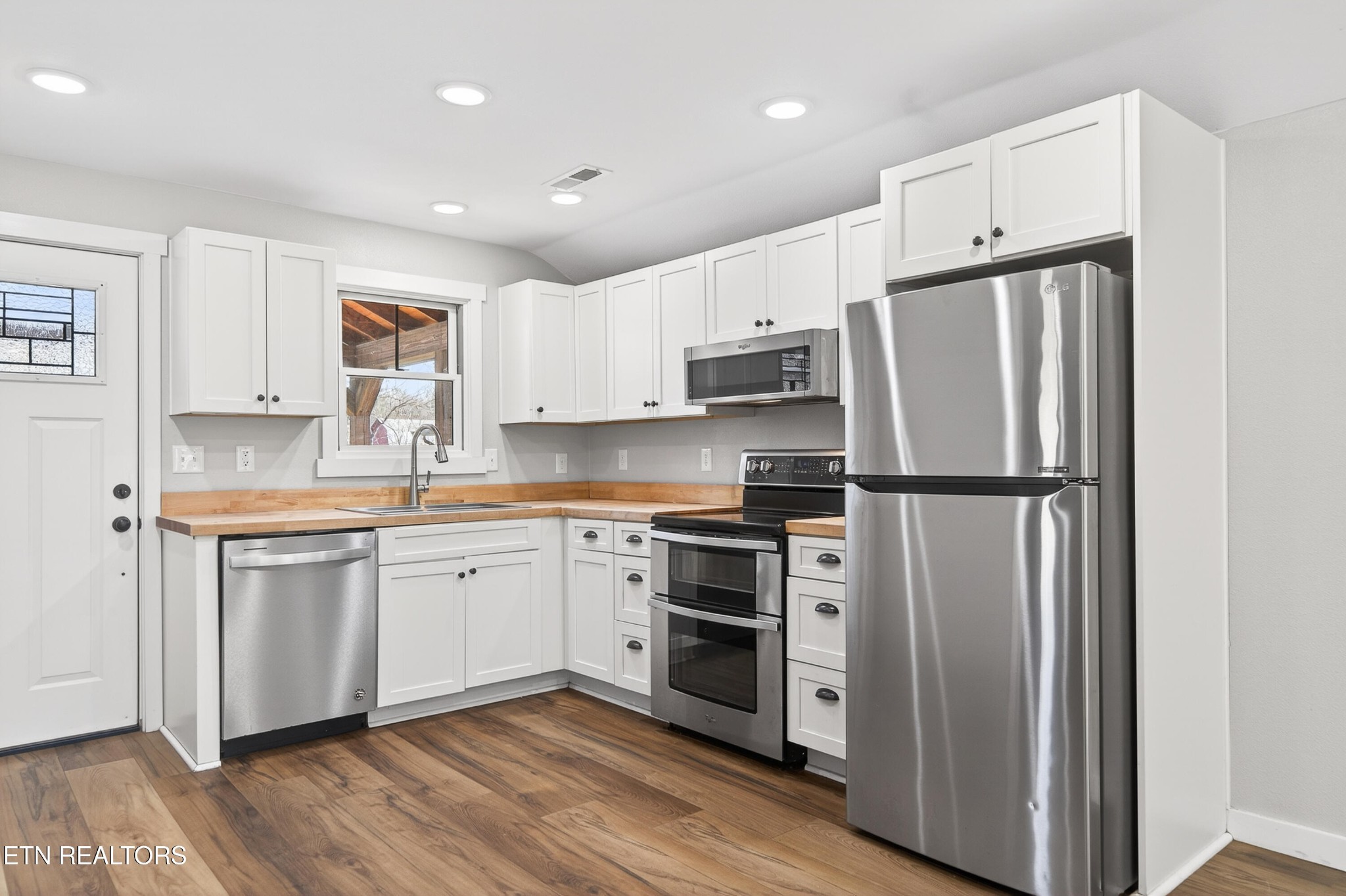 2496 Chestnut Hill Road Crossville, TN 38571 - Photo 10 of 38 a kitchen with stainless steel appliances a refrigerator sink and microwave