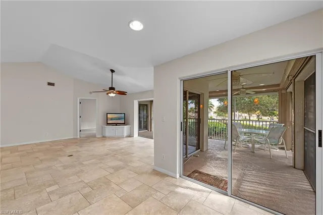 a view of an empty room with glass door