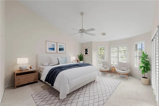 a spacious bedroom with a bed and a window