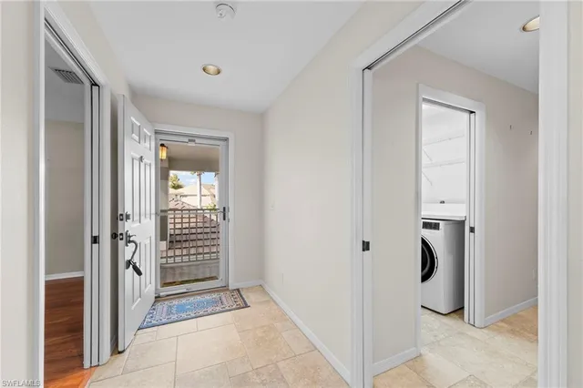 a view of entryway with wooden floor