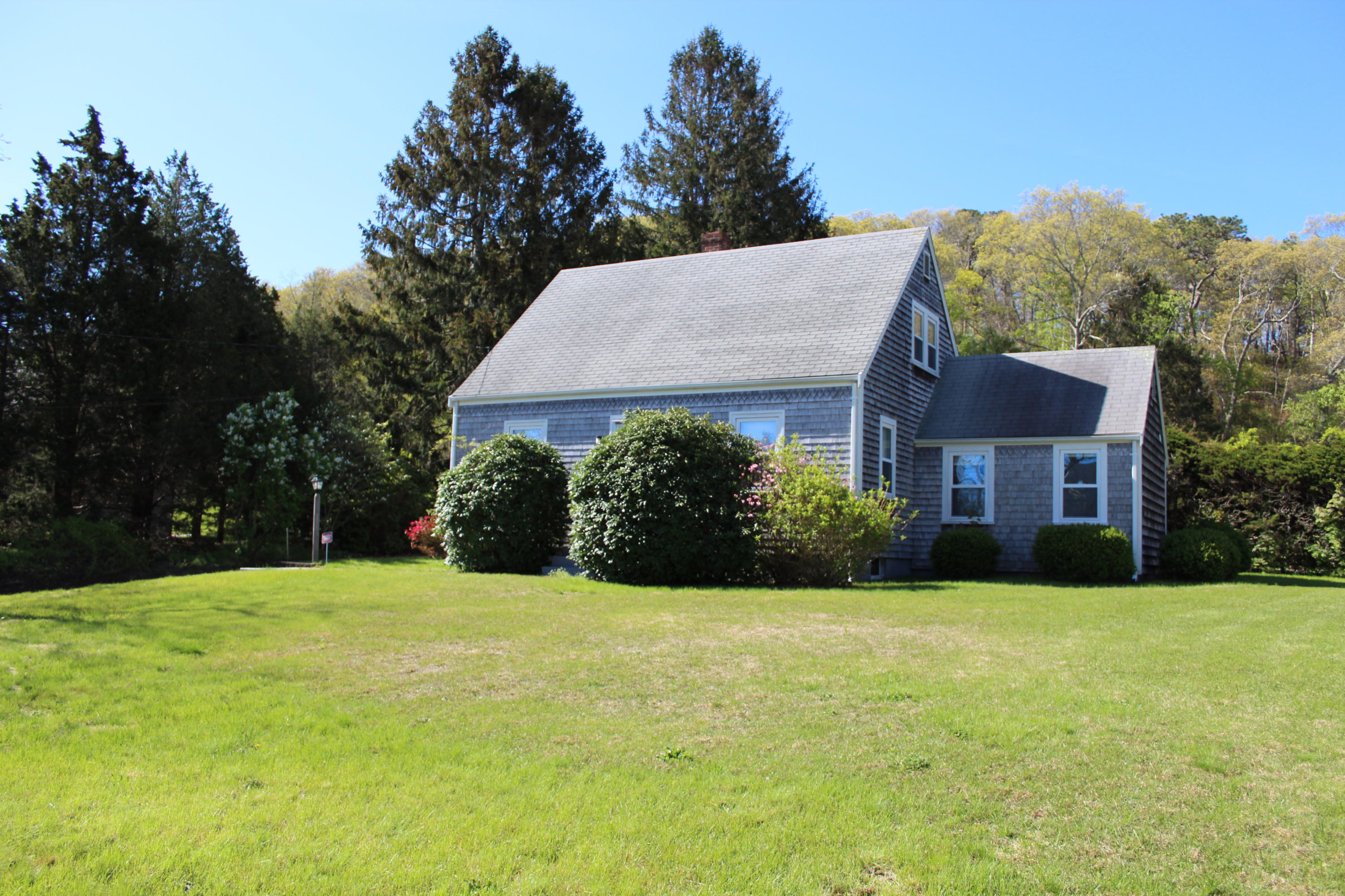 1070 Sandwich Road Sagamore, MA 02561 - Photo 3 of 32 a front view of a house with yard and green space