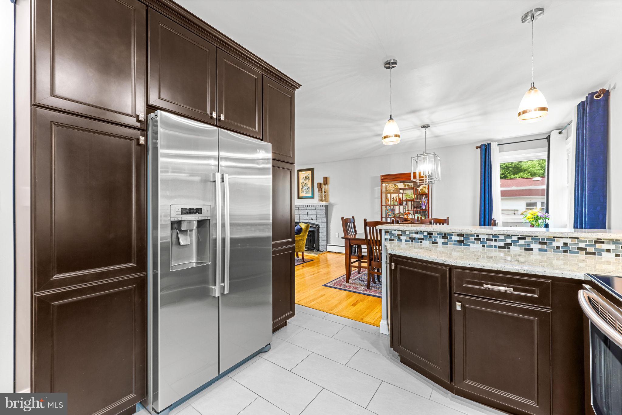 2902 Ritchie Avenue Baltimore, MD 21219 - Photo 15 of 43 a kitchen with stainless steel appliances granite countertop a refrigerator and a stove