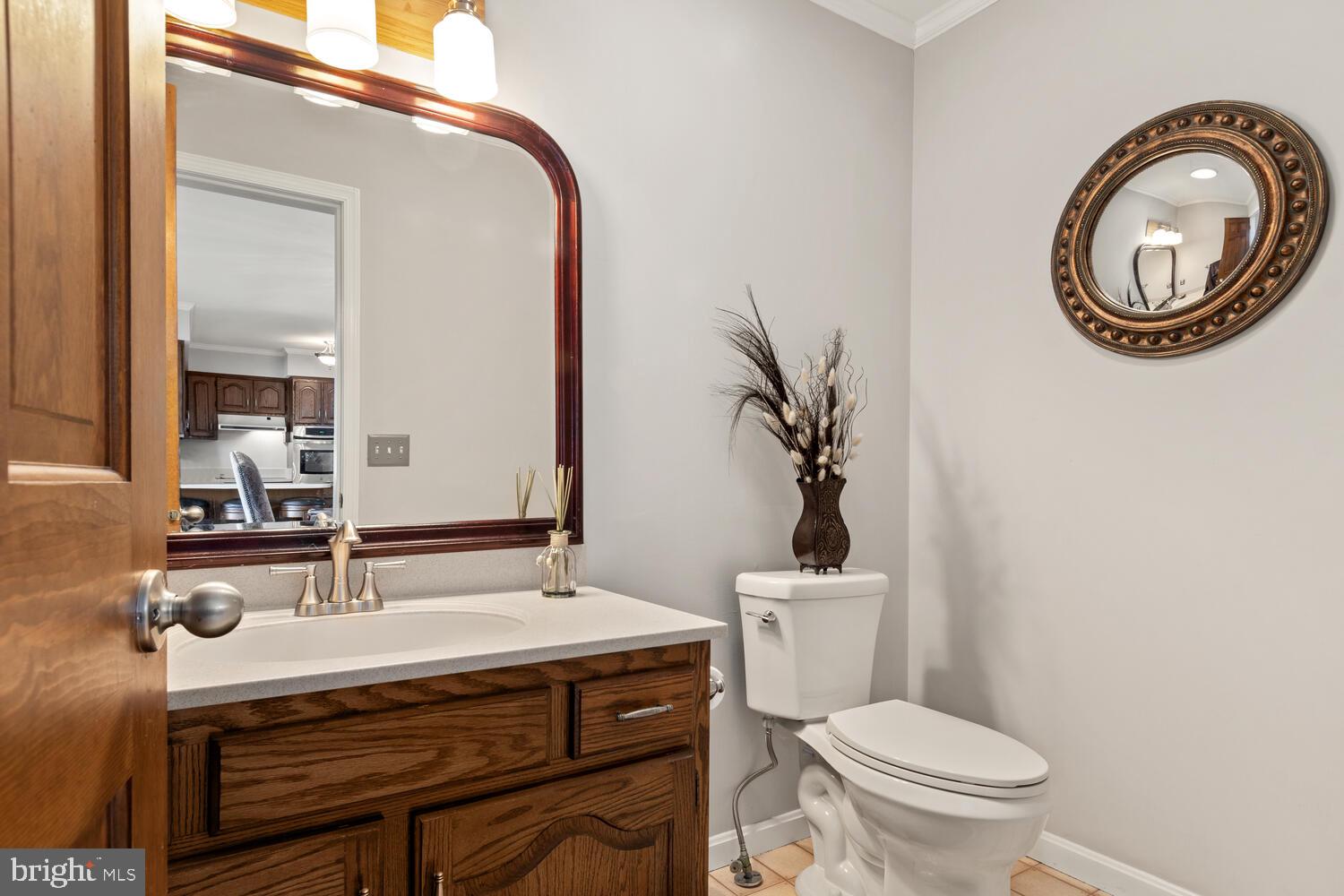 1015 Long Point Road Grasonville, MD 21638 - Photo 20 of 39 a bathroom with a sink and a mirror