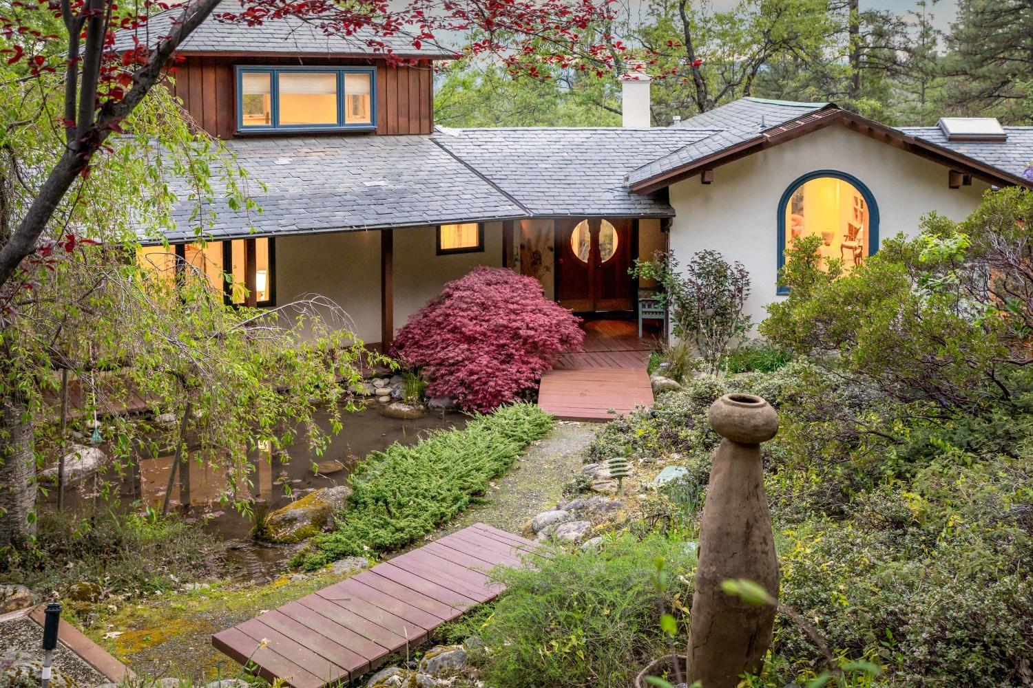 a front view of a house with garden