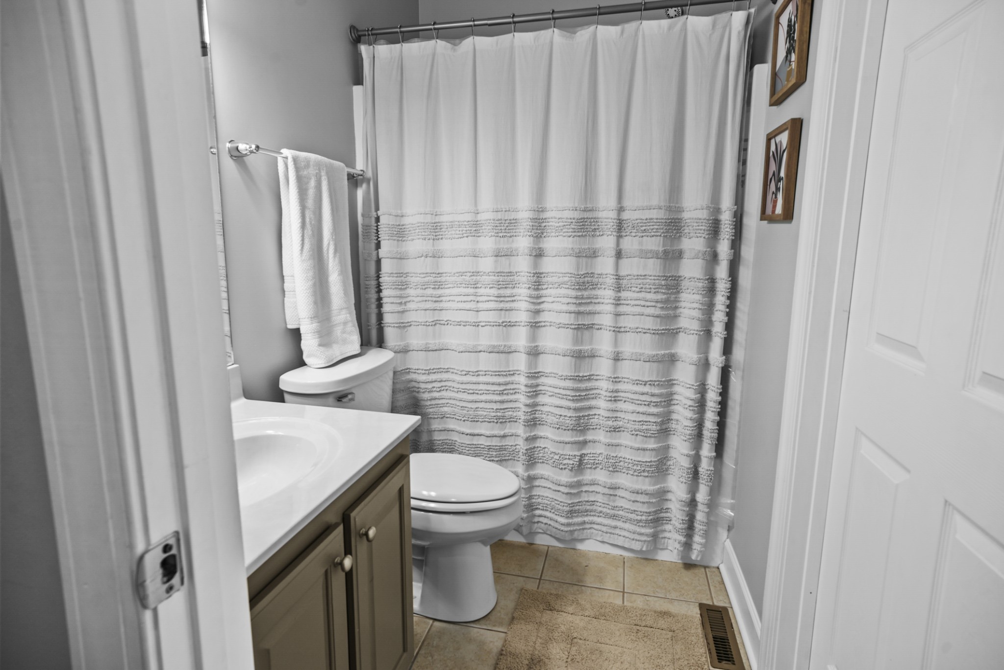 1191 Filmore Harris Road Pleasant View, TN 37146 - Photo 20 of 24 a bathroom with a sink a toilet and shower curtain