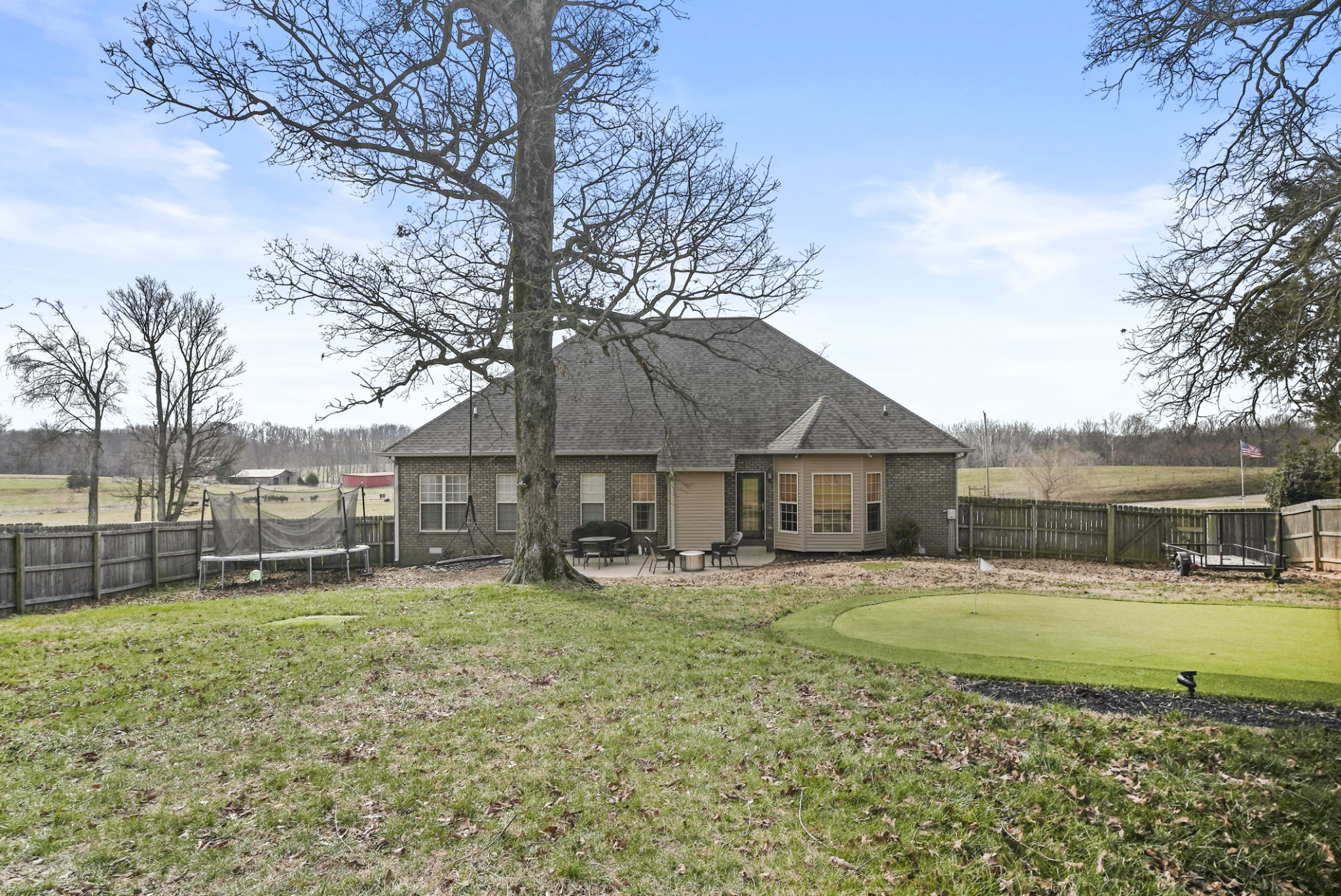 1191 Filmore Harris Road Pleasant View, TN 37146 - Photo 24 of 24 a view of a house with a big yard and a large tree