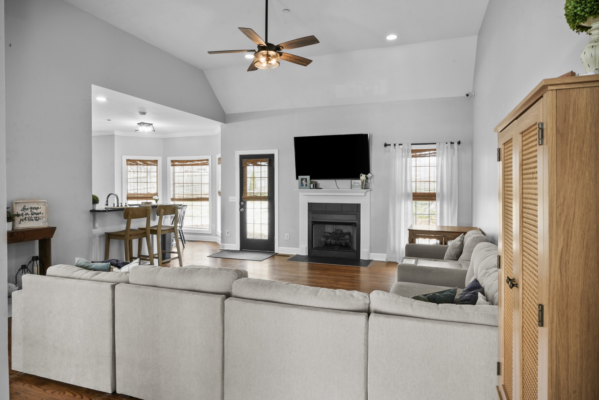 1191 Filmore Harris Road Pleasant View, TN 37146 - Photo 3 of 24 a living room with furniture a fireplace and a flat screen tv