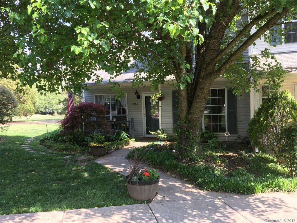 8209 Golf Ridge Drive Charlotte, NC 28277 - Photo 2 of 21 a front view of a house with garden