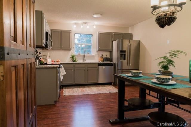 8209 Golf Ridge Drive Charlotte, NC 28277 - Photo 12 of 21 a kitchen with stainless steel appliances a sink stove and refrigerator