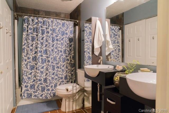 8209 Golf Ridge Drive Charlotte, NC 28277 - Photo 14 of 21 a bathroom with a sink toilet and shower