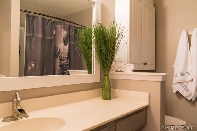 8209 Golf Ridge Drive Charlotte, NC 28277 - Photo 19 of 21 a bathroom with a sink and a mirror