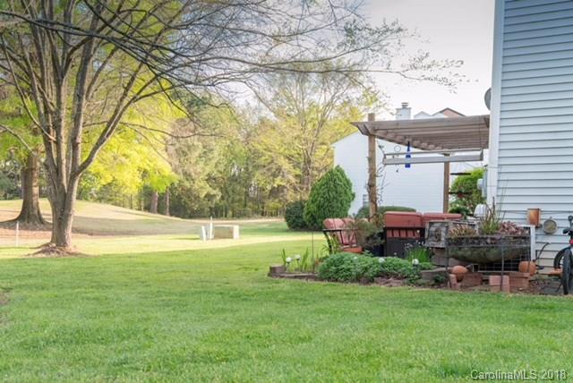 8209 Golf Ridge Drive Charlotte, NC 28277 - Photo 3 of 21 a view of backyard with swimming pool and seating space