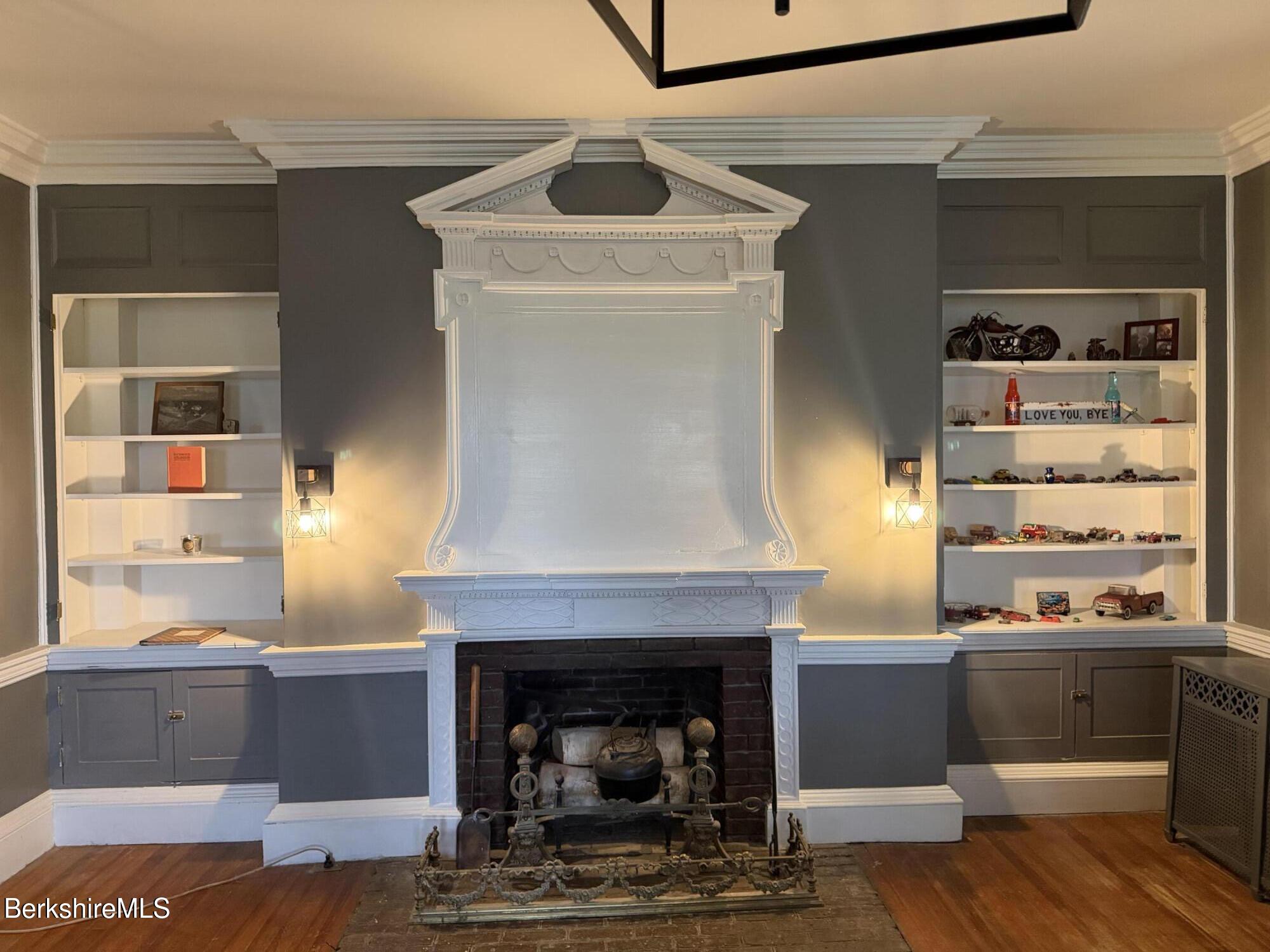 752 State Road Richmond, MA 01254 - Photo 20 of 71 Fireplace with buit in bookshelves