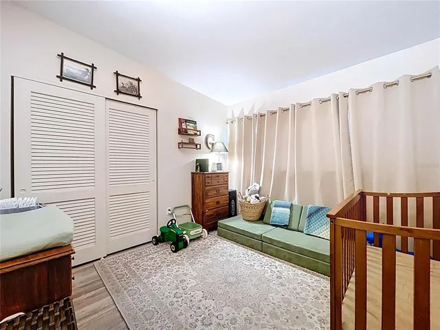 a bedroom with furniture and a window