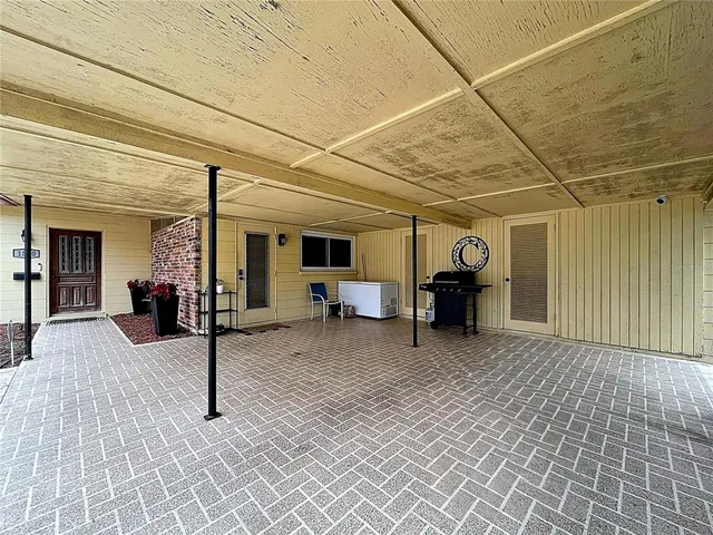 a view of a livingroom with furniture and a window
