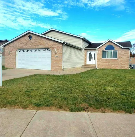 a front view of a house with yard