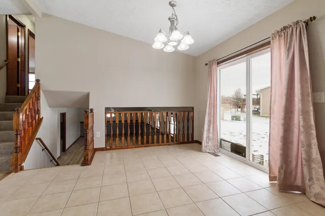 a bathroom with a sink a toilet a mirror and shower