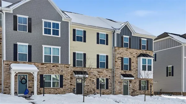 a front view of a building with many windows