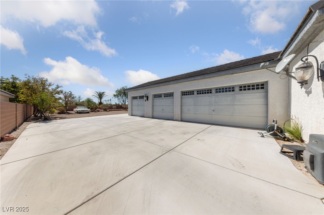 5921 Lone Ranch Avenue Las Vegas, NV 89131 - Photo 3 of 39 4 car garage - Space for RV parking beyond Driveway