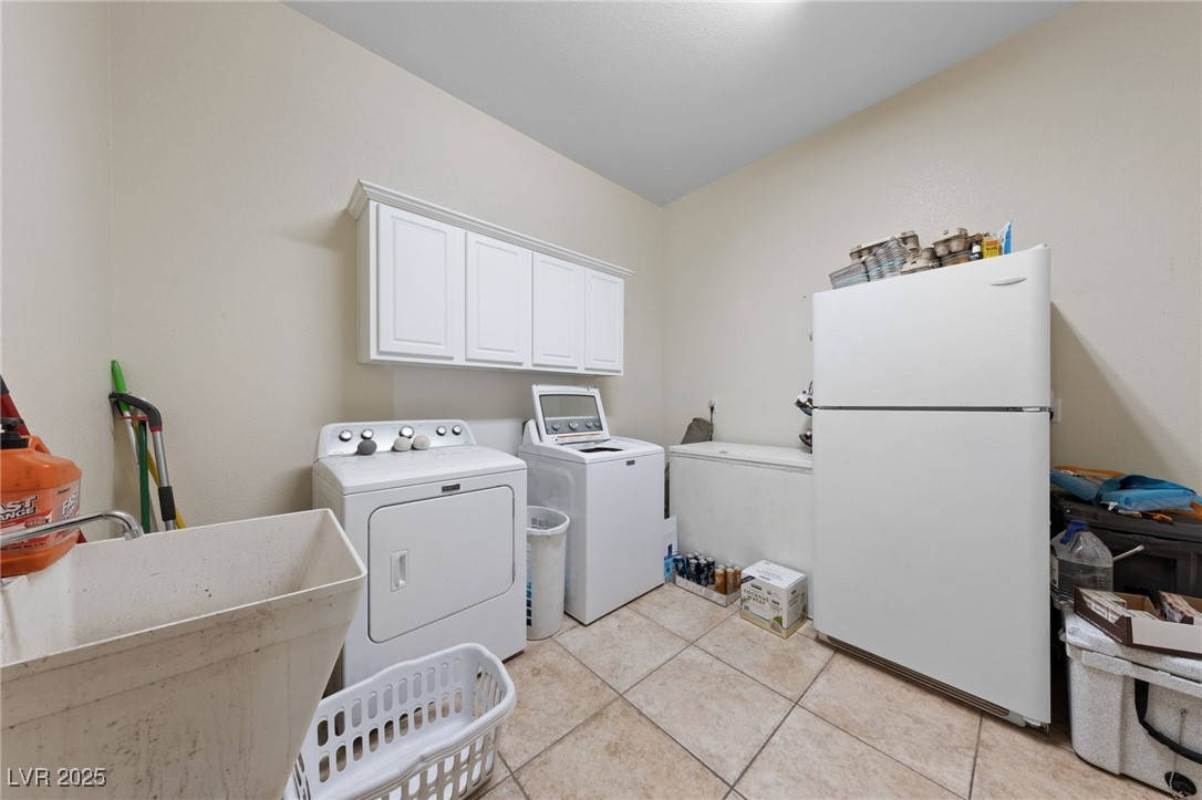 5921 Lone Ranch Avenue Las Vegas, NV 89131 - Photo 36 of 39 Large Laundry entry from garge to kitchen
