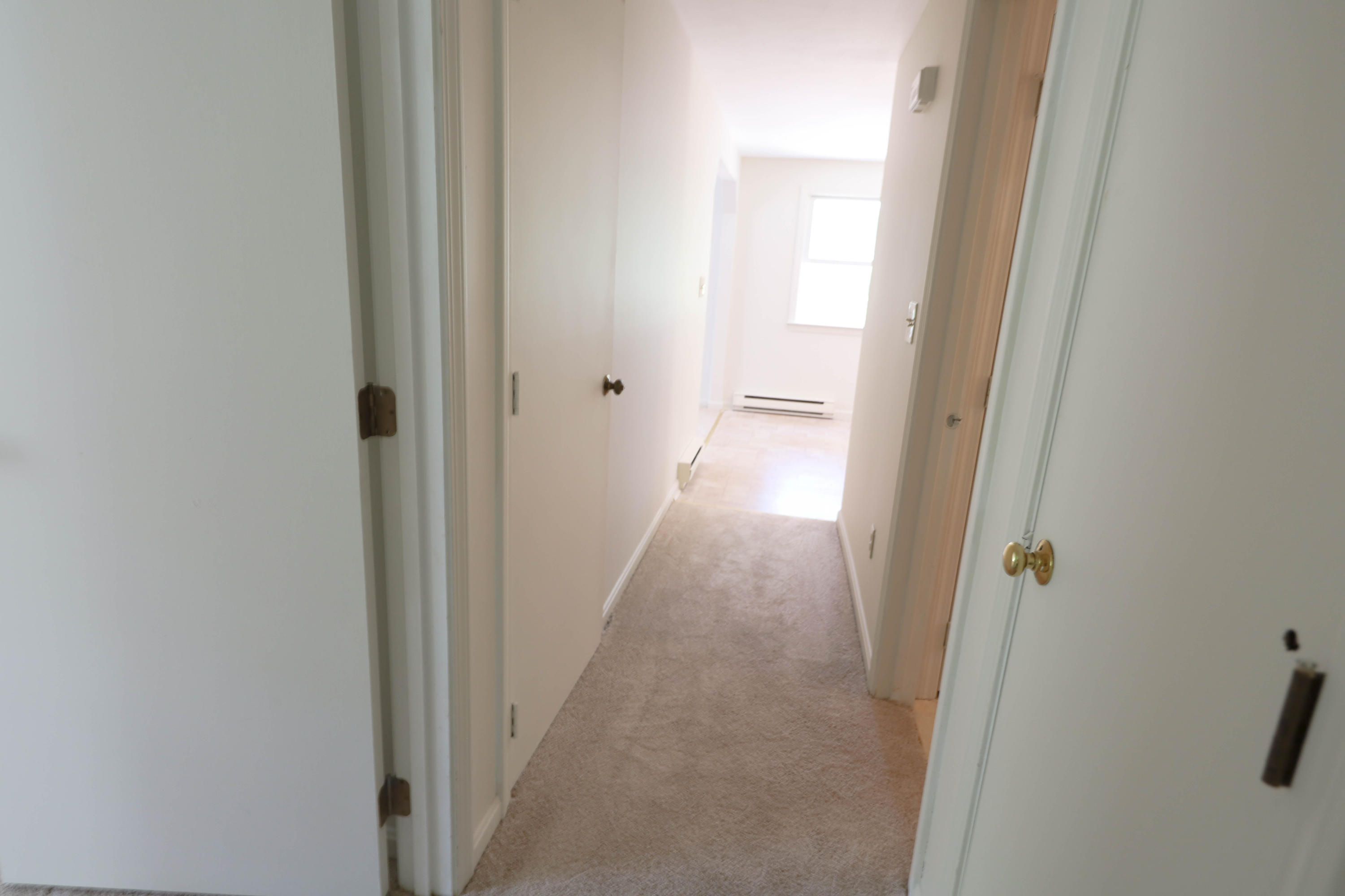 91 Quashnet Road Mashpee, MA 02649 - Photo 15 of 16 a view of a hallway with shower